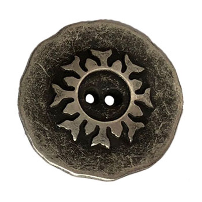 Rund metallknapp med mønster